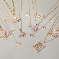 New Long Necklace Creative Small Butterfly Cross Letter Pendant Multi-layer Sweater Chain Wholesale Nihaojewelry main image 1