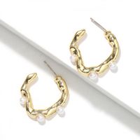 Pure White Pearl Inlaid Wavy Round Hollow Creative Fashion Earrings Wholesale main image 2