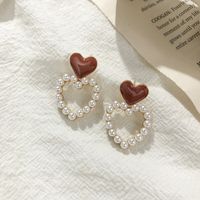 S925 Silver Needle Korean Hollow Love Pearl Sweet Drop Nectarine Heart Stud Earrings Wholesale main image 3