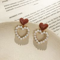 S925 Silver Needle Korean Hollow Love Pearl Sweet Drop Nectarine Heart Stud Earrings Wholesale main image 4