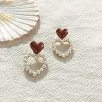 S925 Silver Needle Korean Hollow Love Pearl Sweet Drop Nectarine Heart Stud Earrings Wholesale main image 5