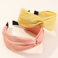 New Retro Fashion Cross Wide Side Knotted Pure Color Fabric Pearl  Hairband main image 1