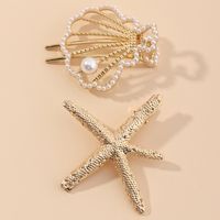 New Beach Hairpin Holiday Golden Starfish Pearl Hollow Small Shell Hairpin Side Clip Wholesale Nihaojewelry main image 1
