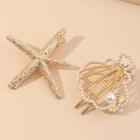 New Beach Hairpin Holiday Golden Starfish Pearl Hollow Small Shell Hairpin Side Clip Wholesale Nihaojewelry main image 3