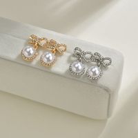 S925 Silver Needle Korea Sweet And Cute Fairy Fashion Bow Pearl Alloy Earrings Wholesale main image 2