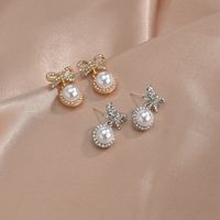 S925 Silbernadel Korea Süße Und Süße Fairy Fashion Bogen Perle Legierung Ohrringe Großhandel main image 3