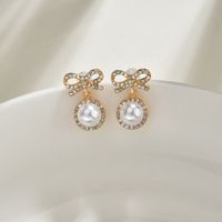 S925 Silver Needle Korea Sweet And Cute Fairy Fashion Bow Pearl Alloy Earrings Wholesale main image 4