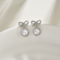 S925 Silver Needle Korea Sweet And Cute Fairy Fashion Bow Pearl Alloy Earrings Wholesale main image 5