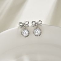 S925 Argent Aiguille Corée Doux Et Mignon Fée Mode Arc Boucles D&#39;oreilles En Alliage De Perles En Gros sku image 2