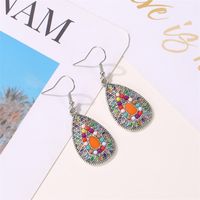 New Retro Colorful Water Drop Ethnic Style Color Sun Flower Drop Oil Earrings Wholesale main image 1