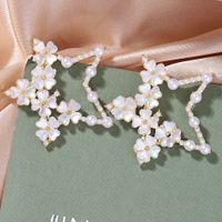 Corée Alliage Incrusté De Perles De Mode Amour Boucles D&#39;oreilles Étoiles À Cinq Branches En Gros main image 4