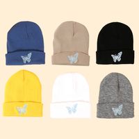Hot Selling Fashion Pure Color Knitted Embroidery Butterfly Warm Woolen Hat Wholesale main image 1