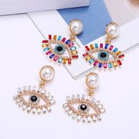 Fashion Exaggerated Devil's Eye Pearl Alloy Inlaid Colored Diamonds Earrings Wholesale main image 2