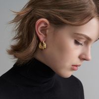 Retro Concave-convex Hammer Surface Metal Circle Irregular Three-dimensional Texture Earrings Wholesale main image 4