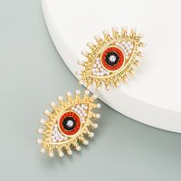 Retro Devil's Eye Alloy Inlaid Pearl Rhinestone Earrings sku image 1