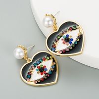 Fashion Heart-shaped Demon Eyes Imitation Pearl Earrings sku image 3