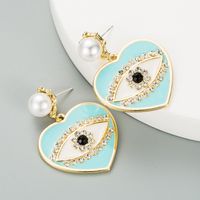 Fashion Heart-shaped Demon Eyes Imitation Pearl Earrings sku image 4