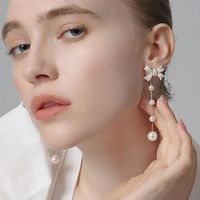 2021 New High-end Atmosphere Long Two-wear Dripping Retro Bow Pearl Earrings main image 1