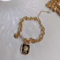 Retro Metallimitat Perle Person Kopf Rundes Markenarmband Halskette Elegantes Armband sku image 1