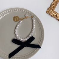 Rétro Métal Imitation Perle Personne Tête Ronde Marque Bracelet Collier Élégant Bracelet sku image 4