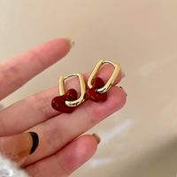 2021 New Metal Texture Red Bean Color Light Luxury French Retro Red Heart Ear Buckle Wholesale sku image 1