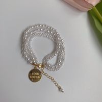 Retro Metal Imitation Pearl Person Head Round Brand Bracelet Necklace Elegant Bracelet main image 5