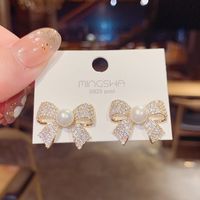 Korean Micro-inlaid Bow Stud Earrings Female Exaggerated Pearl Earrings Wholesale main image 6