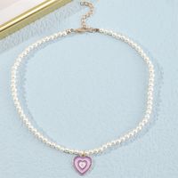 Naizhu Européen Et Américain Collier Français Style Tempérament Brillant Perle Collier Creative Rétro Gouttes D'huile Gradient Couleur Amour Collier main image 5