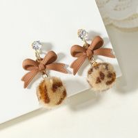 Korean Version Of The Fashion Autumn And Winter New Bow Leopard Hair Ball Earrings Simple Retro Niche Creative Earrings main image 2