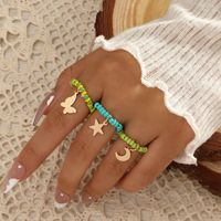 Simple Hand-woven Rice Bead Ring Fashion Temperament Butterfly Moon Star Pendant Elastic 3-piece Set main image 1