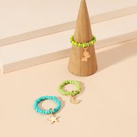 Simple Hand-woven Rice Bead Ring Fashion Temperament Butterfly Moon Star Pendant Elastic 3-piece Set main image 3