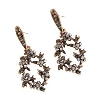 Style Coréen Mode Européenne Et Américaine Style Grande Marque Alliage Diamant Forme De Fleur Creux Boucles D'oreilles Femmes Vintage Bohème Ornement main image 6