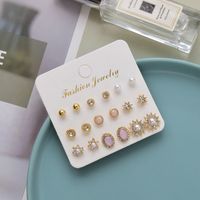 European And American Simple Alloy Pearl Diamond Geometric Round Flower Sun Combination Earrings main image 4