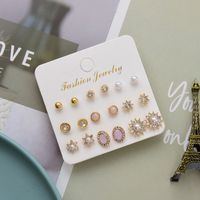European And American Simple Alloy Pearl Diamond Geometric Round Flower Sun Combination Earrings main image 5