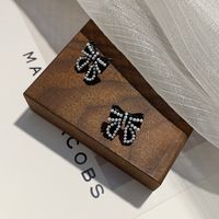 Korean Fashion Temperament Pearl Black Bow Earrings Autumn And Winter New Wild Earrings main image 3