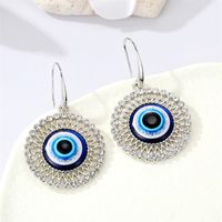 Bijoux Transfrontaliers Européens Rétro Boucles D&#39;oreilles En Strass Creux Ronds Oeil De Démon Bleu main image 4