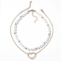 Fashion Short Pearl Wire Winding Cloud Heart Pendant Sweater Chain Wholesale main image 3