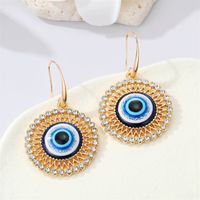 Bijoux Transfrontaliers Européens Rétro Boucles D&#39;oreilles En Strass Creux Ronds Oeil De Démon Bleu sku image 1