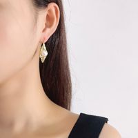 E572 Korean Style S925 Silver Pearl Earrings Women's Irregular Concave And Convex Pleated Leaf-shaped Earring Fashionable Earrings main image 4