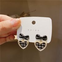 South Korea's New Trendy Design Pearl Lattice Heart Bow Stud Earrings sku image 1