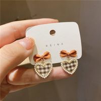 South Korea's New Trendy Design Pearl Lattice Heart Bow Stud Earrings sku image 3