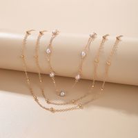 Arbeiten Sie Mehrschichtige Perlenschlüsselbeinkette Weibliche Einfache Lange Legierungshalskette Um sku image 1