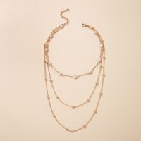 Arbeiten Sie Mehrschichtige Perlenschlüsselbeinkette Weibliche Einfache Lange Legierungshalskette Um main image 3