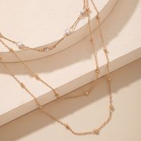 Arbeiten Sie Mehrschichtige Perlenschlüsselbeinkette Weibliche Einfache Lange Legierungshalskette Um main image 5