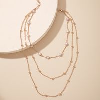 Arbeiten Sie Mehrschichtige Perlenschlüsselbeinkette Weibliche Einfache Lange Legierungshalskette Um main image 6
