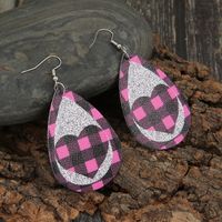 New Pink Black Grid Silver Sequined Leather Earrings Peach Heart Hollow Earrings Wholesale main image 4