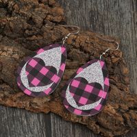 New Pink Black Grid Silver Sequined Leather Earrings Peach Heart Hollow Earrings Wholesale main image 5