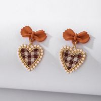925 Silver Needle Vintage Pearl Fabric Love Heart Bow Tie Earrings European And American Ins Simple Autumn And Winter Check Graceful Earrings main image 2
