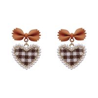 925 Silver Needle Vintage Pearl Fabric Love Heart Bow Tie Earrings European And American Ins Simple Autumn And Winter Check Graceful Earrings main image 6