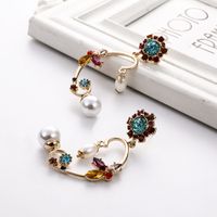 European And American Fashion Trendy Irregular Alloy Rhinestone Pearl Earrings Flower Flower Symmetrical Female Earrings Cross-border Hot Sale main image 2